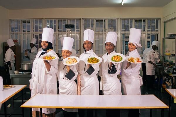 Impact Chefs and Hospitality Institute students display their cooked food