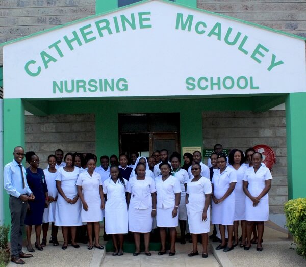 Catherine McAuley Nursing School students pose with staff outside admin block
