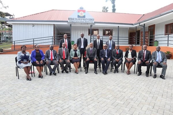 Defence College of Health Sciences staff and directors pose for a photo